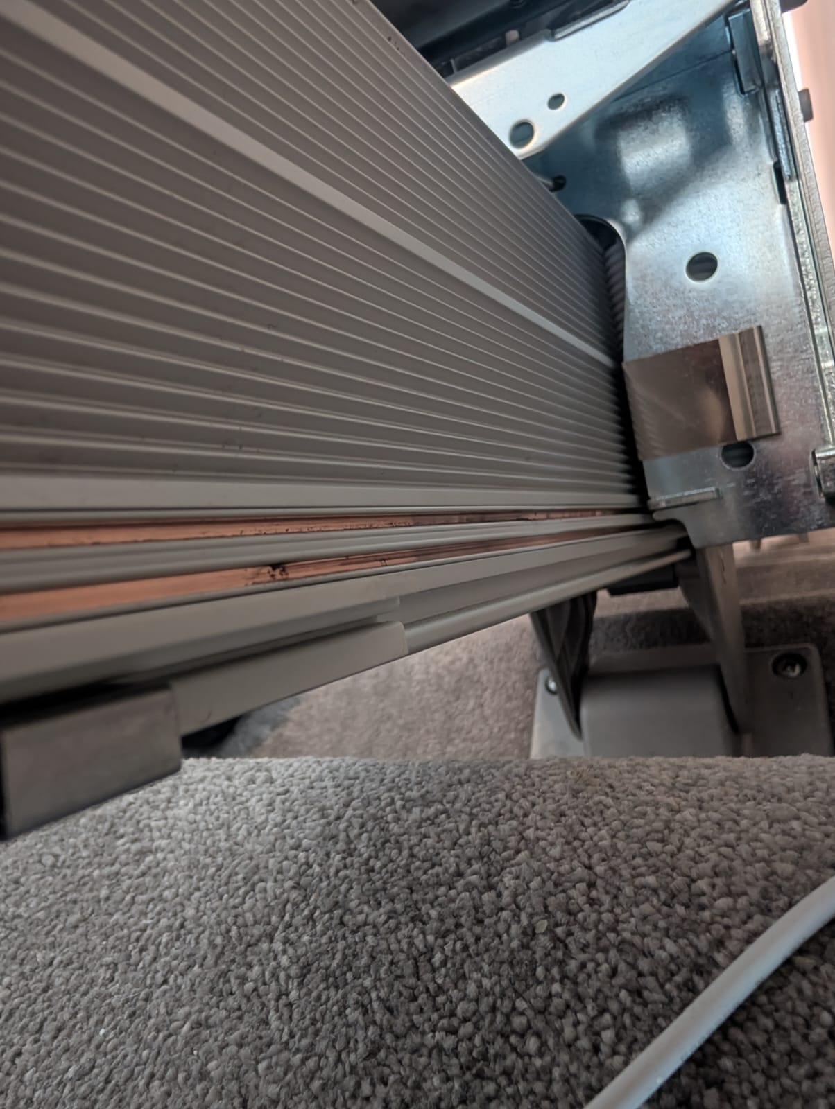 Charging contact strip inspection on the Handicare 1100 stairlift rail