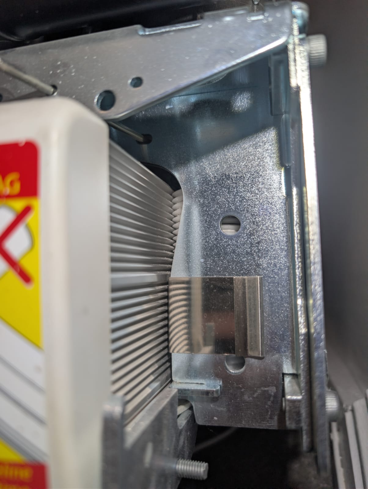 Close-up inspection of the serrated drive roller on the Handicare 1100 rail