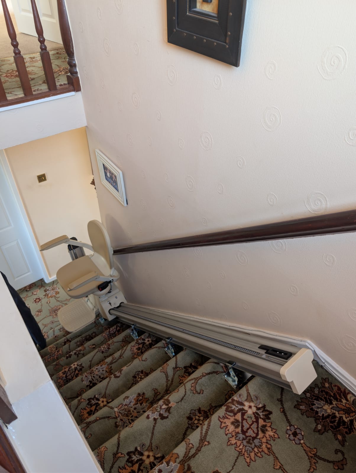 View looking down the full rail from the top landing