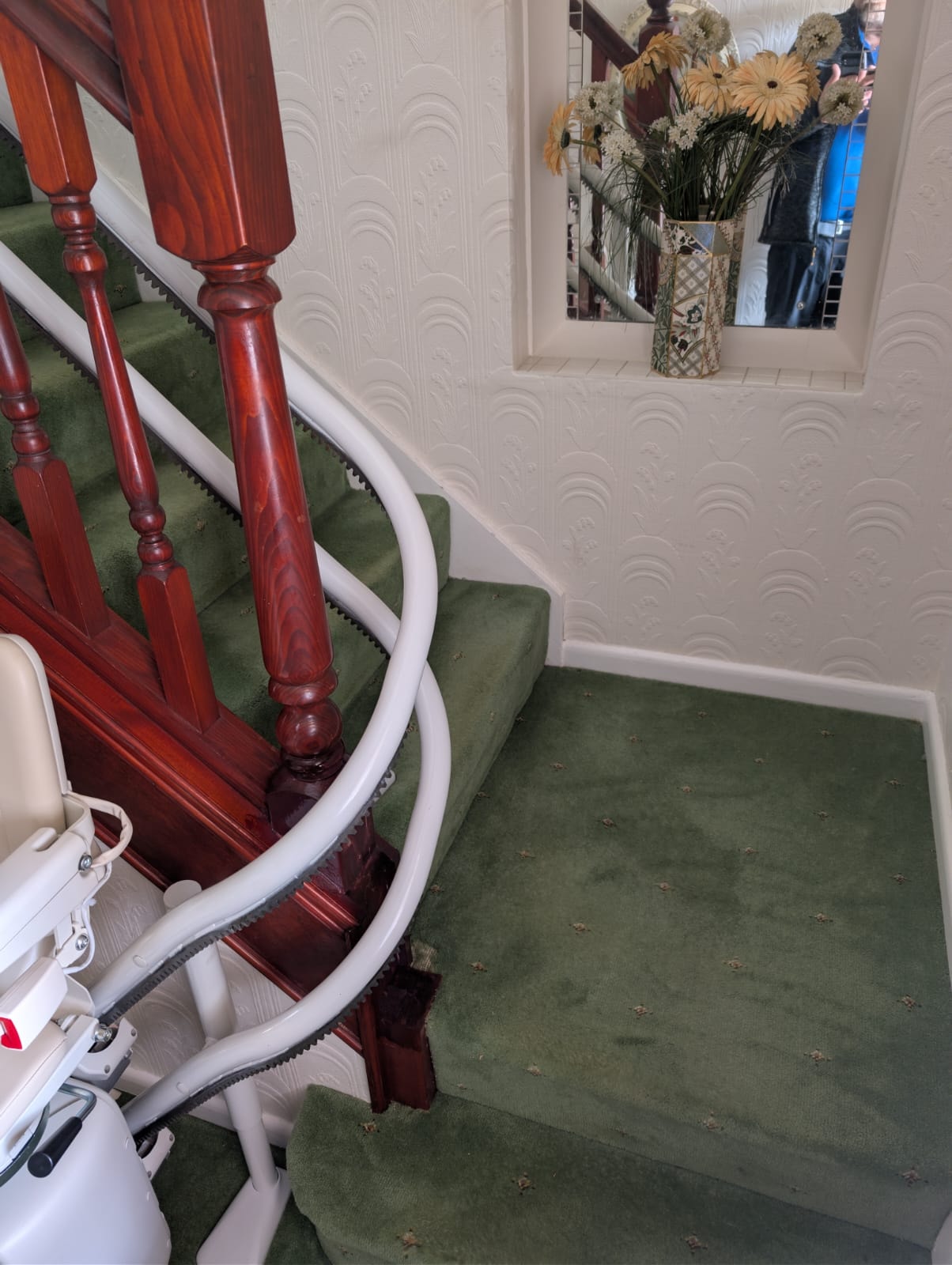 Bottom of stairs view of the Handicare 4000 curved stairlift