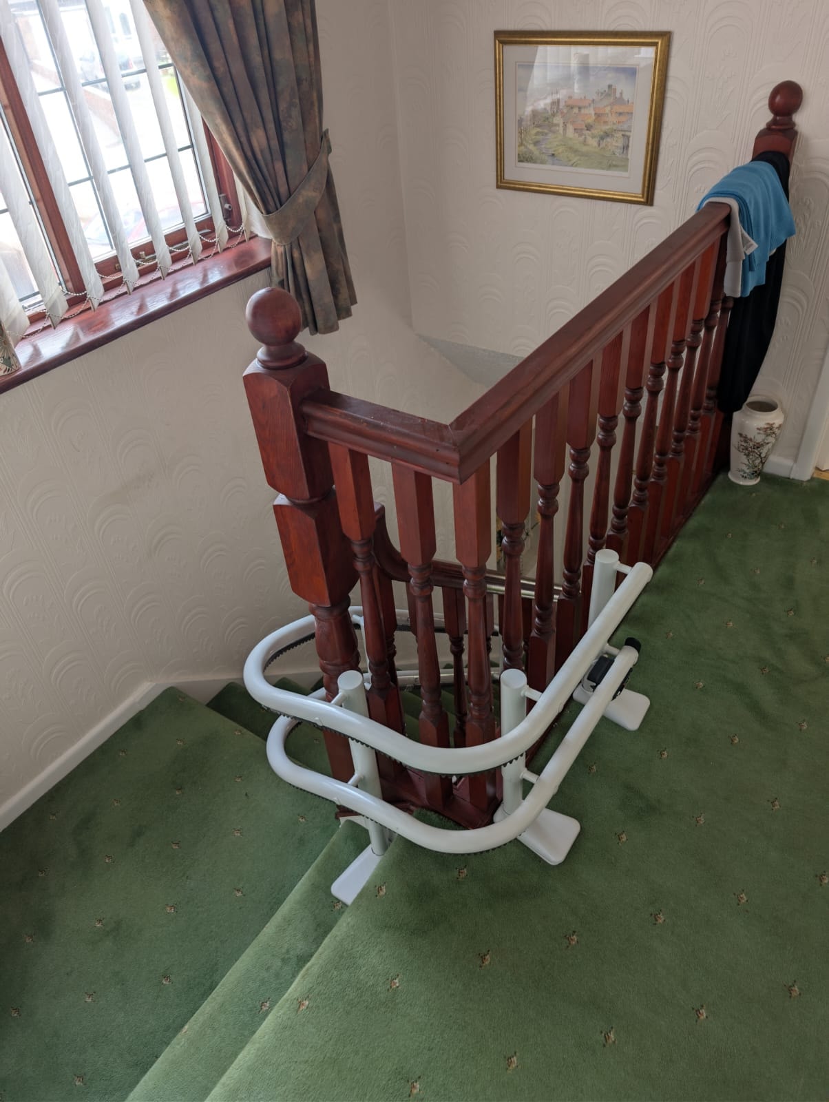 Top of stairs view of the Handicare 4000 curved stairlift