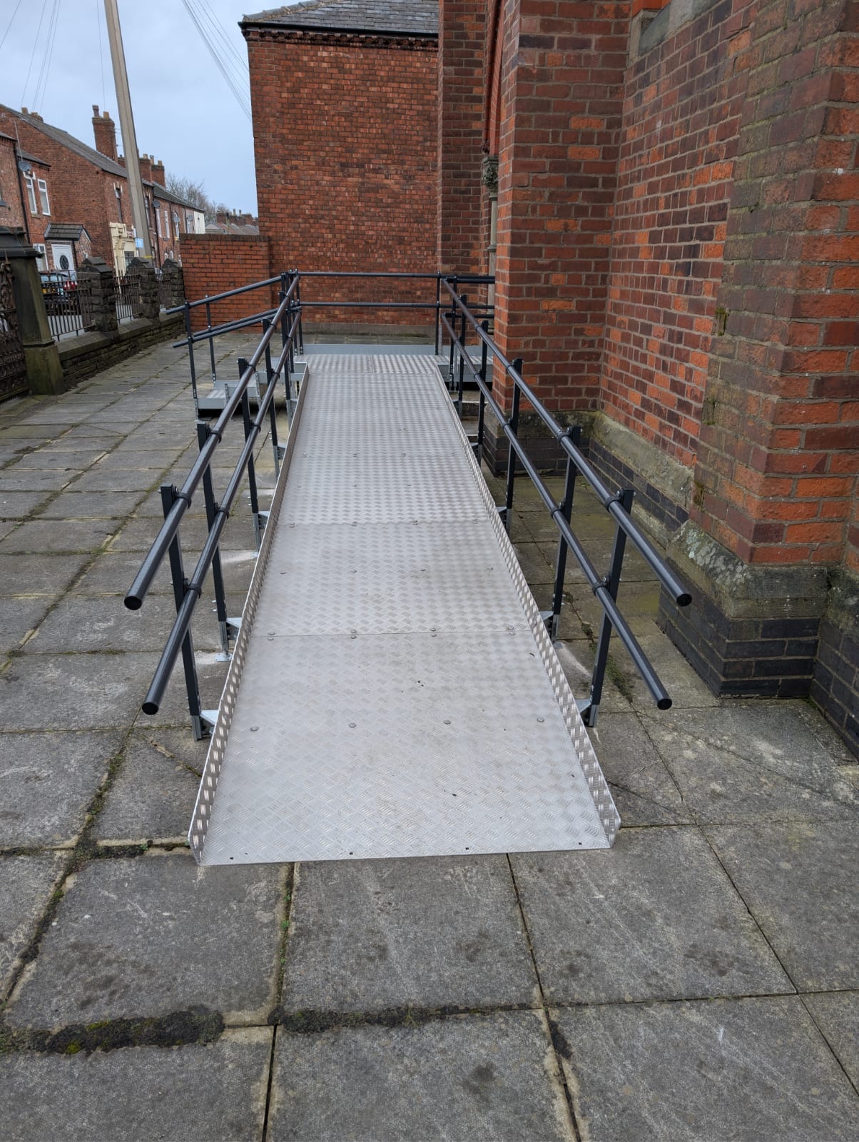 Modular ramp system showing handrail detail