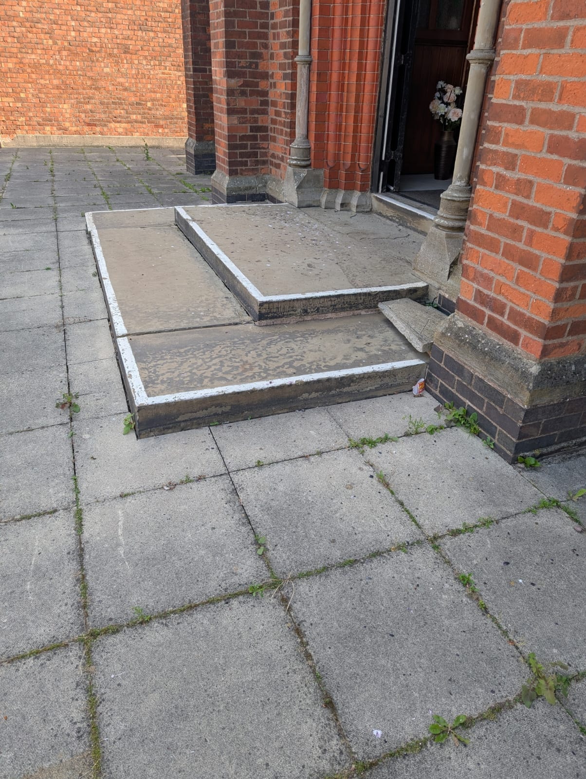 Side view of church entrance steps before ramp installation